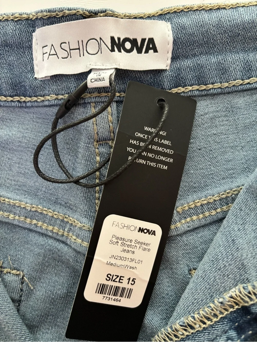 Fashion Nova Light Blue High-Rise Flare Jeans with Knee Rips - Picture 5 of 5